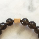 Men's grounding grey smoky quartz beaded energy bracelet with gold hexagon bead