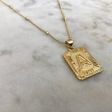 Gold initial necklace on delicate satellite chain