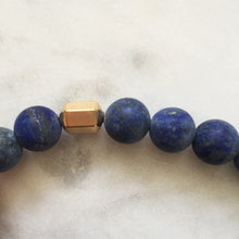 Men's blue lapis lazuli beaded energy bracelet with gold hexagon bead