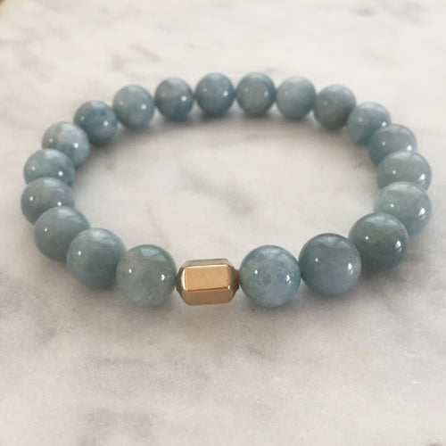 Men's light blue aquamarine beaded energy bracelet with gold hexagon bead