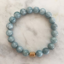 Men's light blue aquamarine beaded energy bracelet with gold hexagon bead