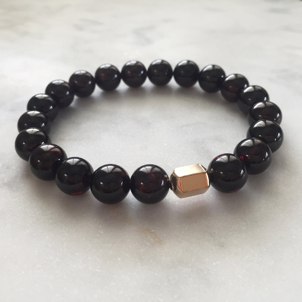 Men's red garnet beaded energy bracelet with gold hexagon bead