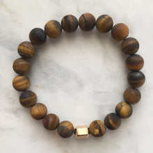 Men's matte golden tiger's eye beaded energy fertility bracelet with gold hexagon bead