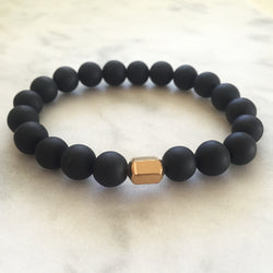 Men's matte black onyx beaded energy bracelet with gold hexagon bead