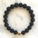 Men's matte black onyx beaded energy bracelet with gold hexagon bead