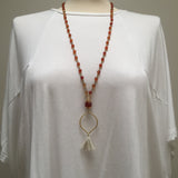beaded red carnelian mala yoga jewelry necklace on a mannequin