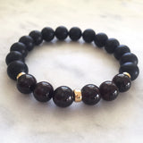 Men's black onyx and red garnet beaded energy bracelet for vata dosha with gold beads