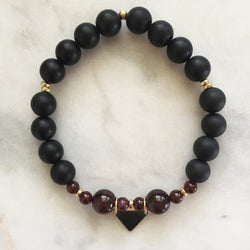 Black onyx and red garnet pregnancy yoga jewelry bracelet with gold triangle charm